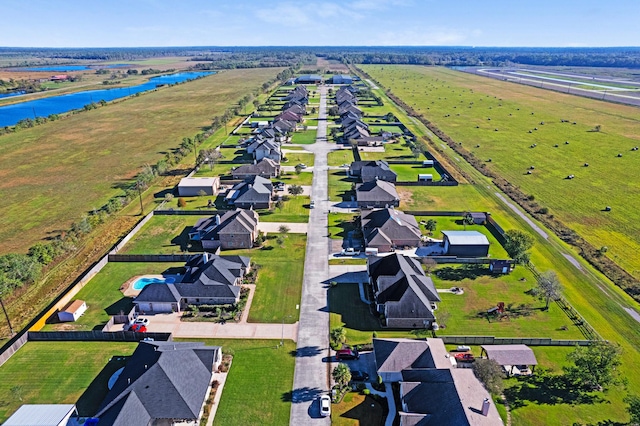 bird's eye view featuring a water view and a rural view