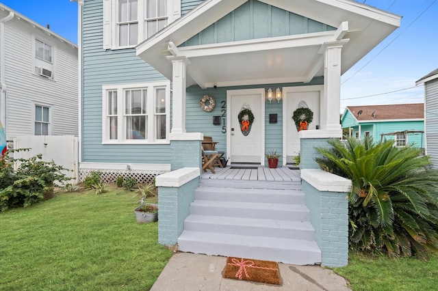 doorway to property featuring a yard