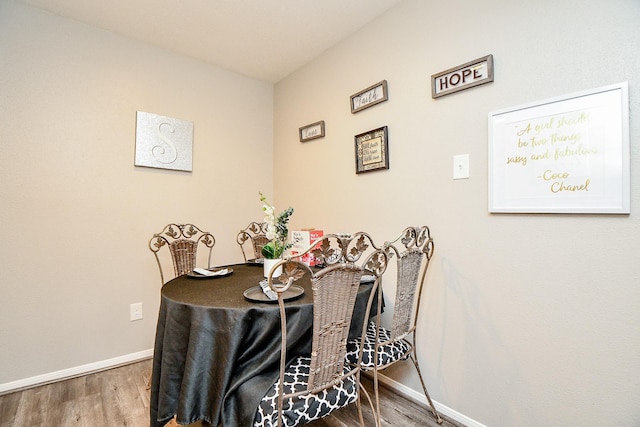 dining room with wood-type flooring