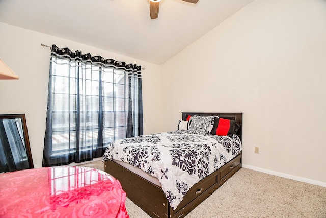 bedroom with ceiling fan, light colored carpet, and lofted ceiling