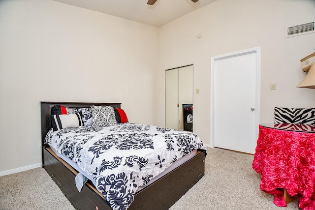 bedroom with carpet flooring, ceiling fan, and a closet