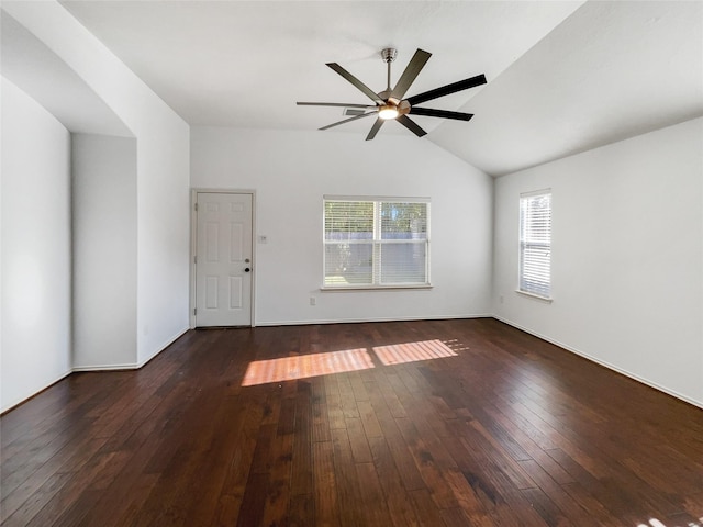 unfurnished room featuring ceiling fan, lofted ceiling, and dark wood-type flooring