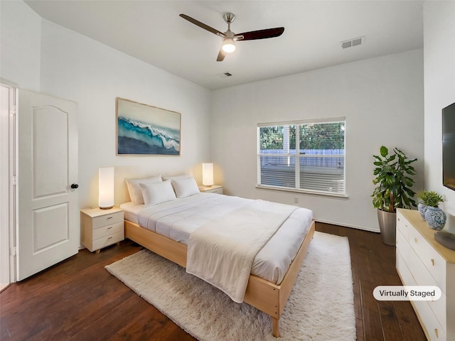 bedroom featuring dark hardwood / wood-style flooring and ceiling fan