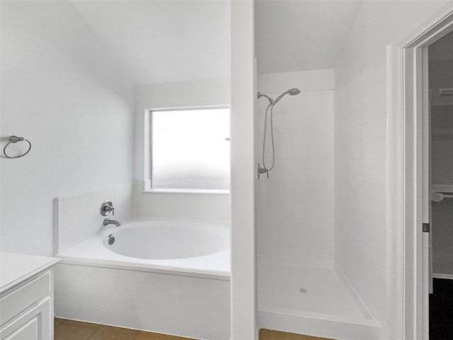 bathroom with tile patterned floors, vanity, and separate shower and tub