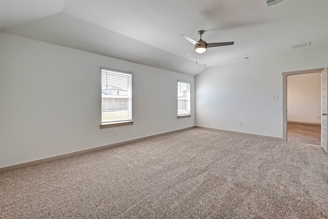 spare room with carpet flooring, ceiling fan, and lofted ceiling