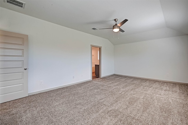 unfurnished room with carpet floors, vaulted ceiling, and ceiling fan