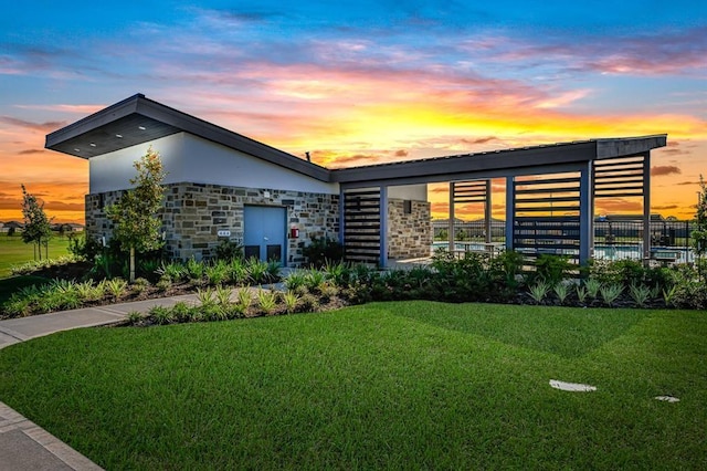 contemporary home featuring a lawn