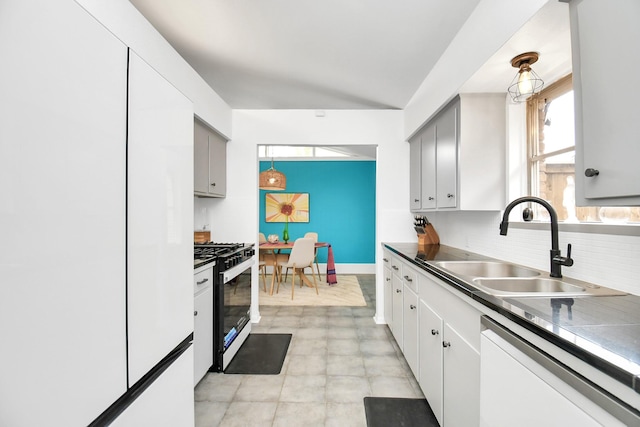 kitchen with decorative backsplash, gray cabinetry, dishwashing machine, sink, and stainless steel range with gas cooktop