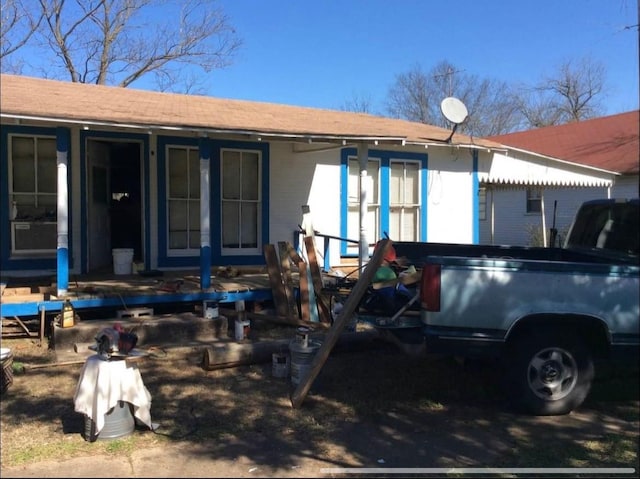 back of house with a porch