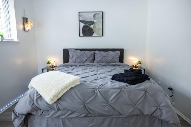 bedroom featuring wood-type flooring