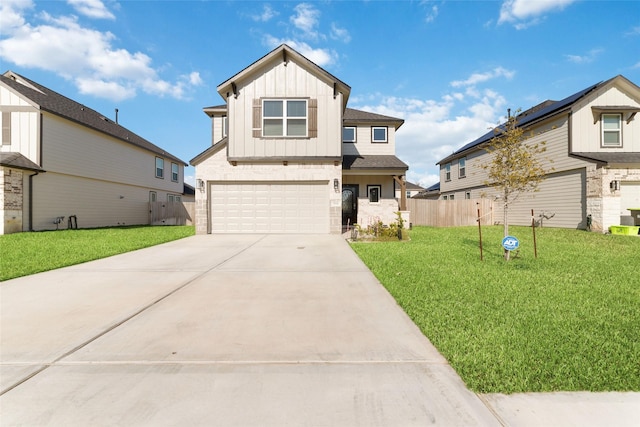 view of front facade with a garage and a front lawn