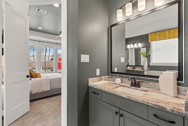 bathroom featuring vanity and ceiling fan