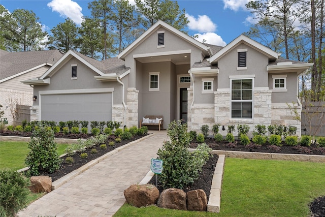 view of front of home featuring a front yard and a garage