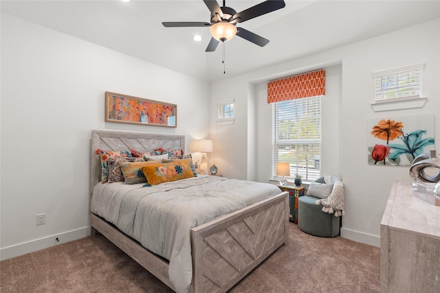 bedroom featuring ceiling fan and light carpet