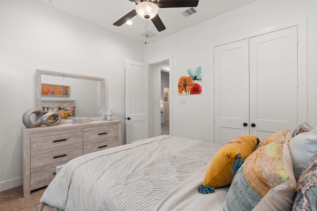 bedroom featuring ceiling fan, a closet, and carpet floors