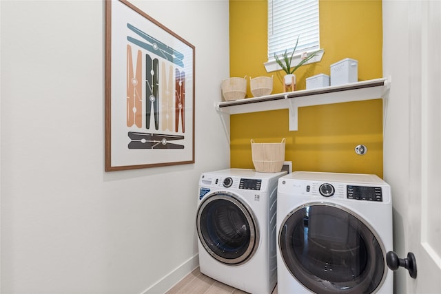 laundry room featuring light hardwood / wood-style flooring and independent washer and dryer