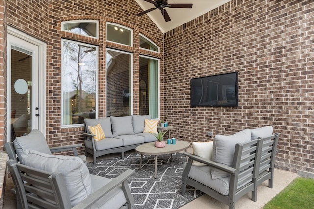 view of patio with outdoor lounge area and ceiling fan