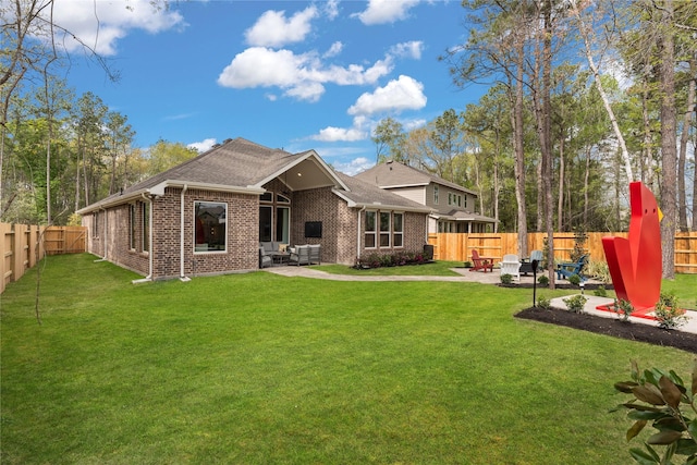 back of property featuring a lawn and a patio area