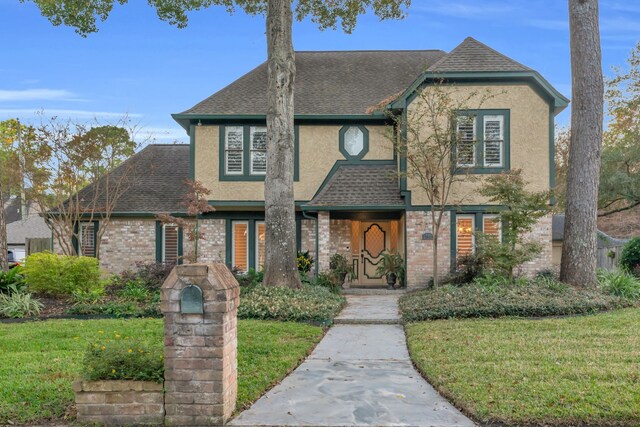 tudor house with a front lawn