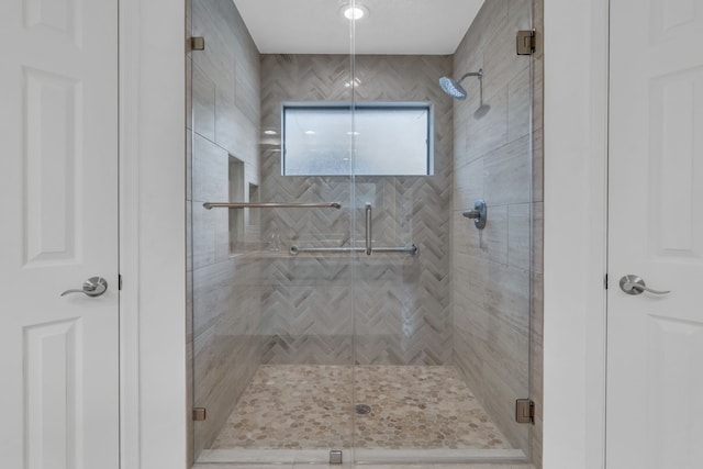 bathroom featuring an enclosed shower