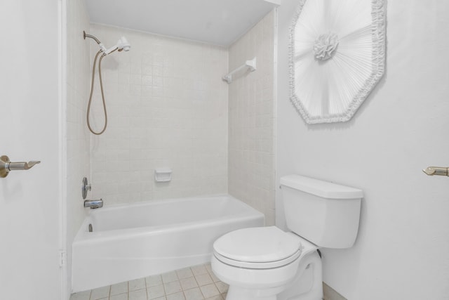 bathroom featuring shower / tub combination, tile patterned floors, and toilet