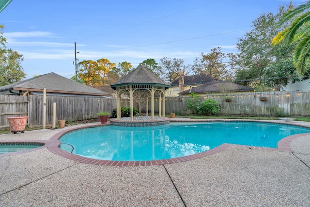 view of swimming pool featuring a gazebo and a patio