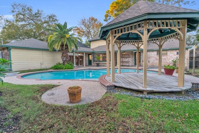 view of swimming pool with a gazebo, a jacuzzi, and a deck