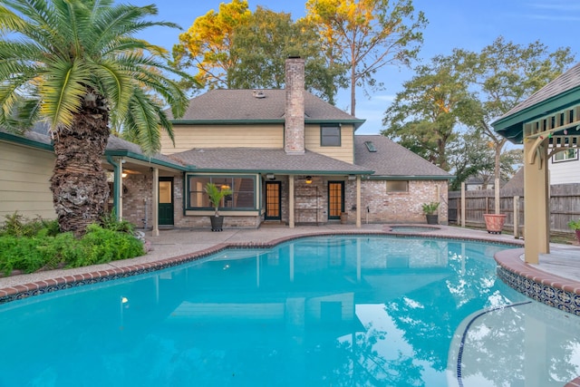 view of swimming pool featuring a patio area