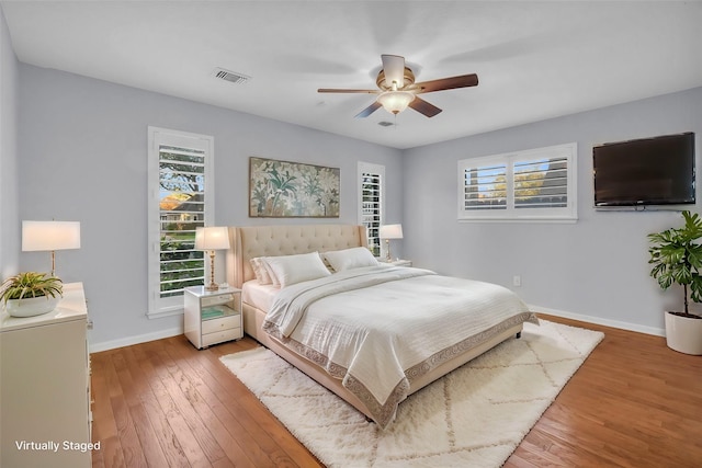 bedroom with wood-type flooring and ceiling fan