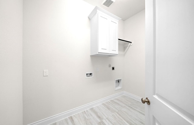 laundry room featuring hookup for an electric dryer, visible vents, cabinet space, baseboards, and hookup for a washing machine