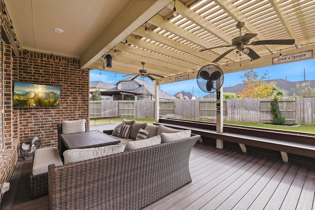 wooden deck with a mountain view, an outdoor hangout area, and a pergola