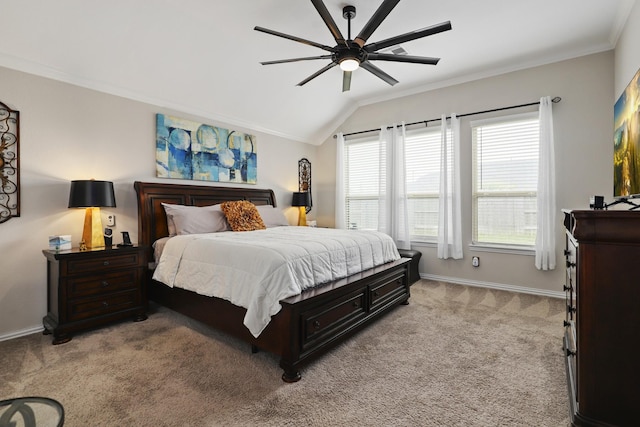 carpeted bedroom with ceiling fan, lofted ceiling, and ornamental molding