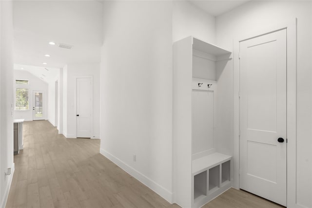 mudroom featuring recessed lighting, light wood-type flooring, visible vents, and baseboards