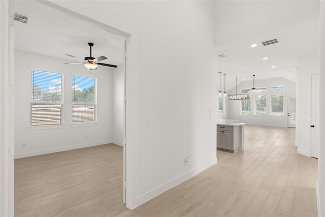 hallway with light hardwood / wood-style flooring