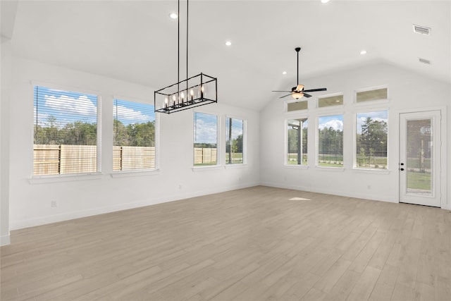 unfurnished living room with recessed lighting, visible vents, baseboards, vaulted ceiling, and light wood-type flooring