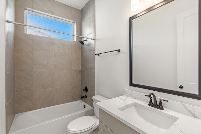 full bath featuring tub / shower combination, vanity, and toilet