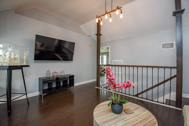 interior space with dark hardwood / wood-style floors and vaulted ceiling