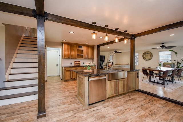 kitchen featuring ceiling fan, sink, light hardwood / wood-style flooring, stainless steel dishwasher, and decorative light fixtures