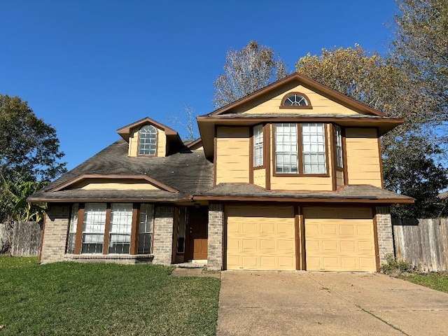 view of front facade with a front lawn and a garage