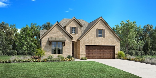 view of front of home featuring a front lawn and a garage