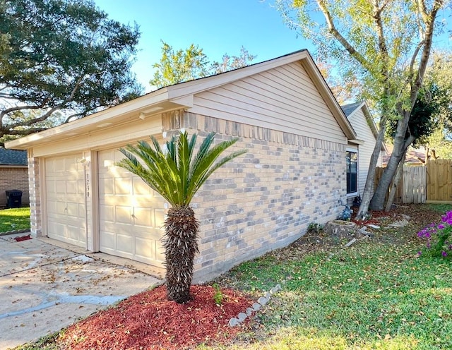 view of property exterior with a garage and an outbuilding