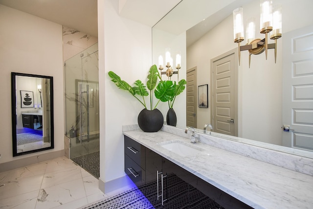 bathroom with vanity and a shower with shower door