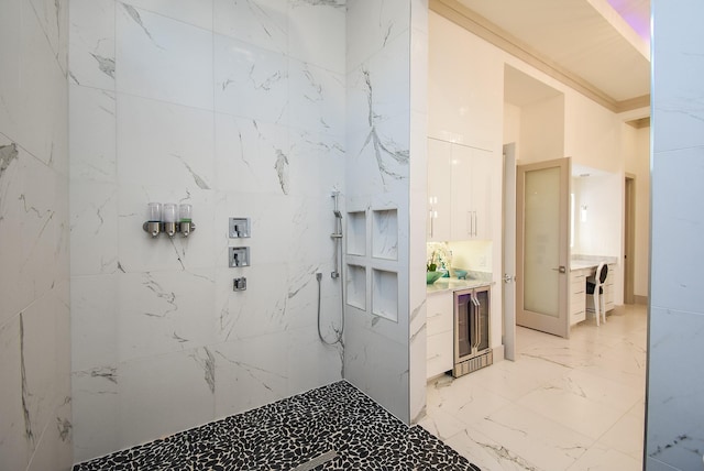 bathroom with vanity and a shower