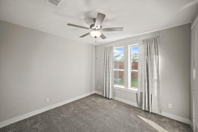 carpeted empty room featuring ceiling fan