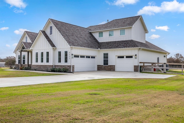 view of front of property with a garage and a front lawn