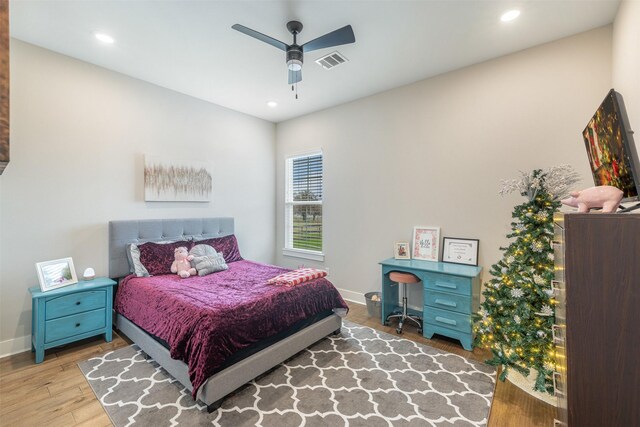 bedroom with ceiling fan and hardwood / wood-style floors