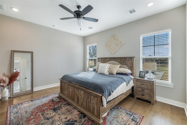 bedroom featuring hardwood / wood-style flooring and ceiling fan