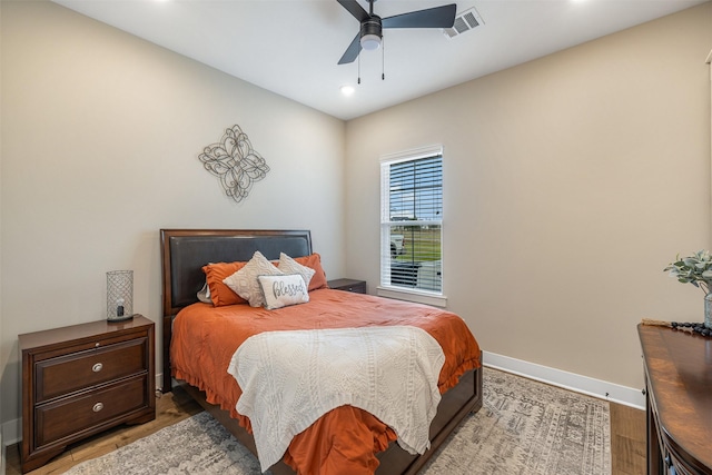 bedroom featuring ceiling fan and hardwood / wood-style floors