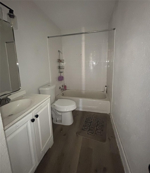 full bathroom with vanity,  shower combination, toilet, and wood-type flooring