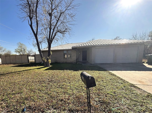 ranch-style house with a front yard and a garage